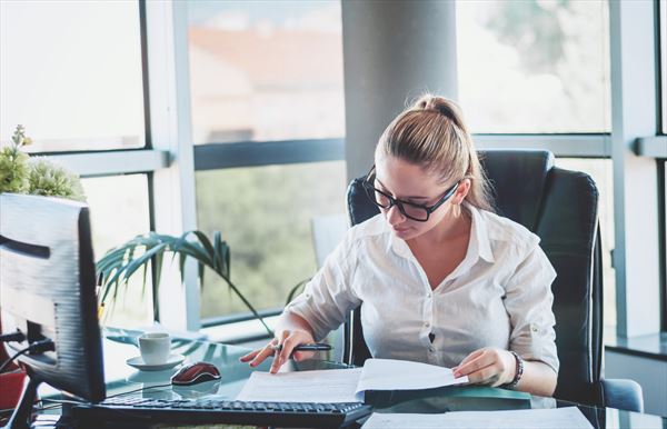 company secretarial photo via women working in office