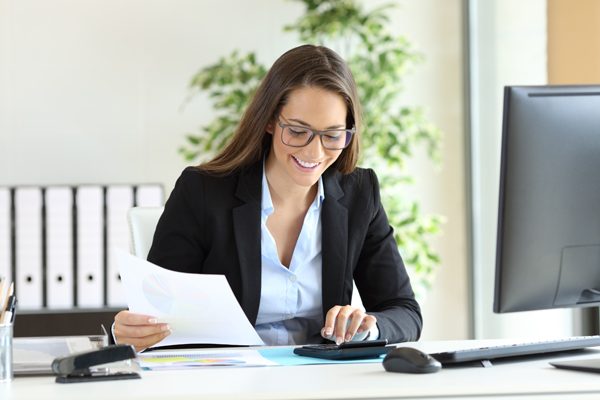 accountant services tax outsourcing photo via women smiling working in office