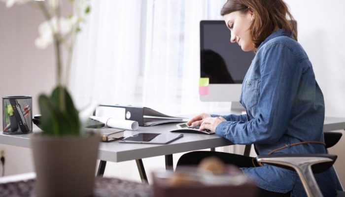 company secretarial photo via women working in office on accounts